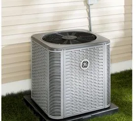 Inverter heat pump outdoor condenser unit installed beside a home